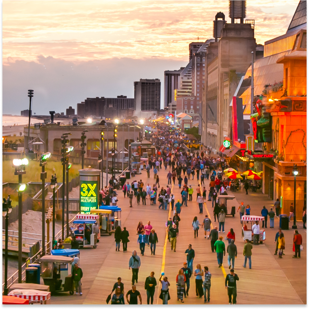 Overhead view of people walking down the Atlantic City Boardwalk.